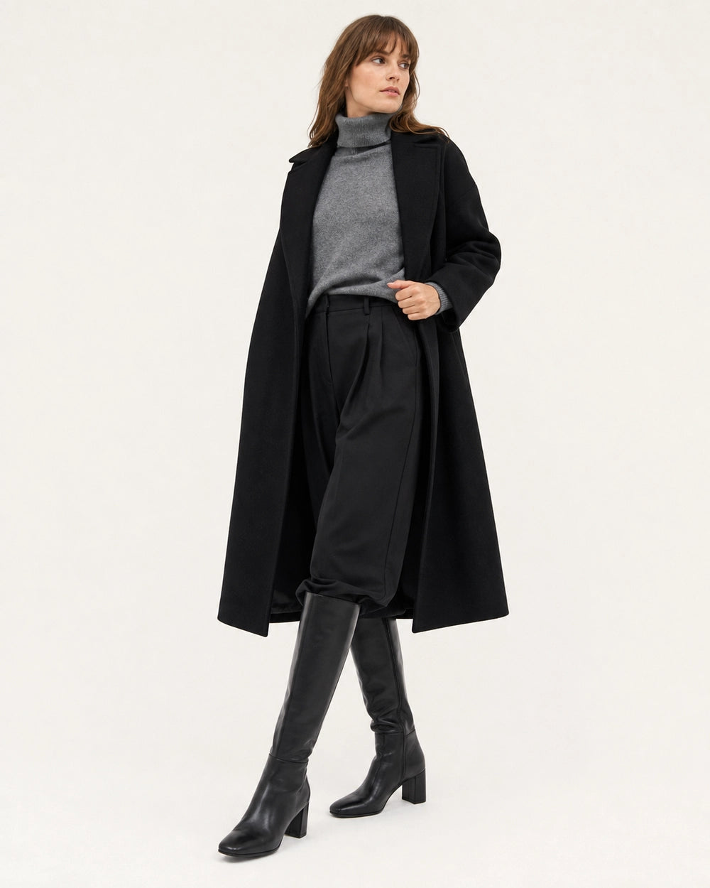 Women's black knee-high boots with a broad block heel, hero view.