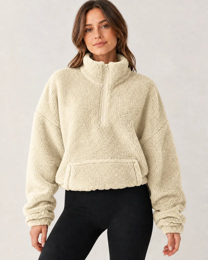 Women's beige plush half-zip pullover, worn front view